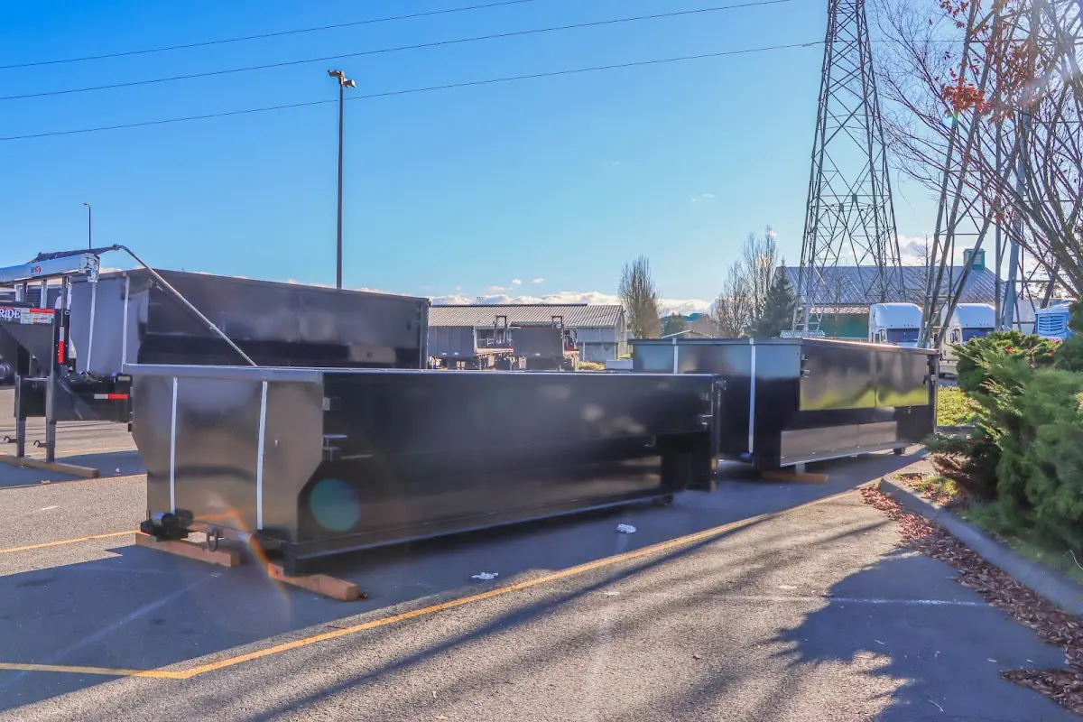 Roll-off dumpster ready for waste disposal at job site for 2 Yard Dumpster Rental in Savoy